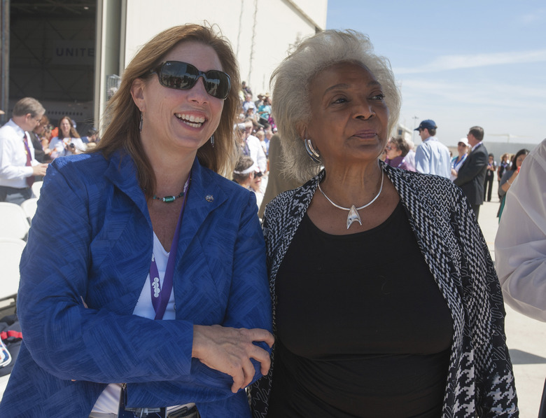 NASA Deputy Administrator Lori Garver (L) and actress Nichelle Nichols from the science fiction television show Star Trek look to the sky as they wait for space shuttle Endeavour prior to its arrival, at Los Angeles International Airport September 21, 2012. Endeavour touched down in Los Angeles on Friday on the back of a jumbo jet, greeted by cheering crowds as it ended a celebratory final flight en route to its retirement home at a Southern California science museum. The 75-ton winged spaceship, ferried by a modified Boeing 747, landed at Los Angeles International Airport after hop-scotching across the country from Cape Canaveral, Florida, and flying a victory lap over California. Endeavour will next undergo preparations to be moved through city streets to the California Science Center in downtown Los Angeles, where it will be put on display starting October 30. REUTERS/Paul E. Alers/NASA/Handout (UNITED STATES - Tags: SCIENCE TECHNOLOGY TRANSPORT ENTERTAINMENT) MANDATORY CREDIT. FOR EDITORIAL USE ONLY. NOT FOR SALE FOR MARKETING OR ADVERTISING CAMPAIGNS. THIS IMAGE HAS BEEN SUPPLIED BY A THIRD PARTY. IT IS DISTRIBUTED, EXACTLY AS RECEIVED BY REUTERS, AS A SERVICE TO CLIENTS