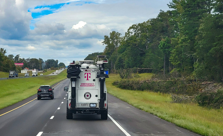 A truck with the T-Mobile logo on the road.