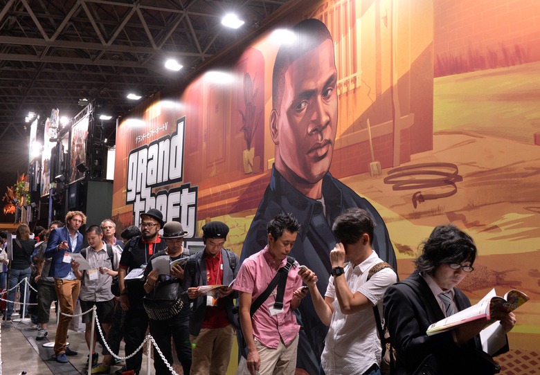 Visitors queue to play the new Rockstar Games videogame 