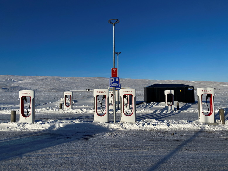 Tesla electric vehicles chargers are seen in a petrol station on King road during the winter in Staour, Iceland February 12, 2022. Picture taken February 12, 2022. REUTERS/Nacho Doce