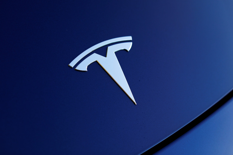 The front hood logo on a 2018 Tesla Model 3 electric vehicle is shown in this photo illustration taken in Cardiff, California, U.S., June 1, 2018. Picture taken June 1, 2018.    REUTERS/Mike Blake