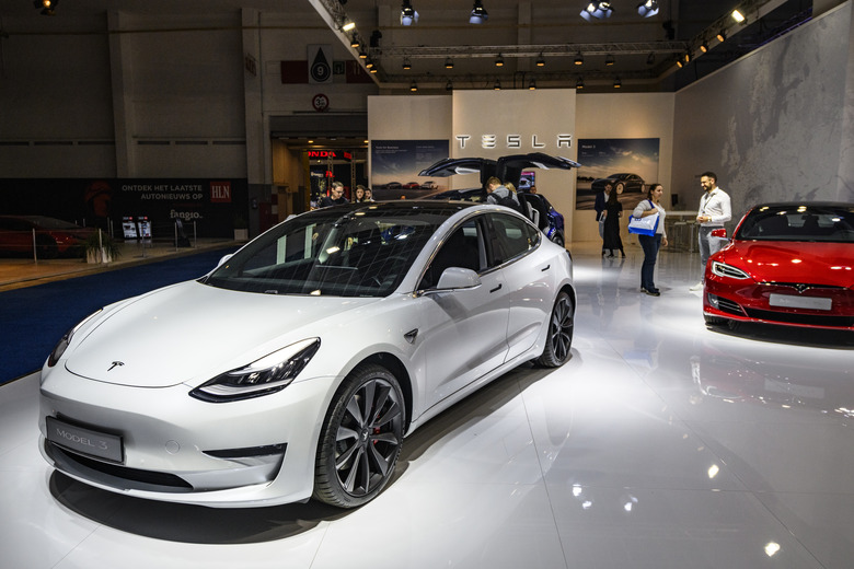BRUSSELS, BELGIUM - JANUARY 09: Tesla Model 3 compact sedan car in white on display at Brussels Expo on January 9, 2020 in Brussels, Belgium. The Model 3 is fitted with a full self-driving system. (Photo by Sjoerd van der Wal/Getty Images)