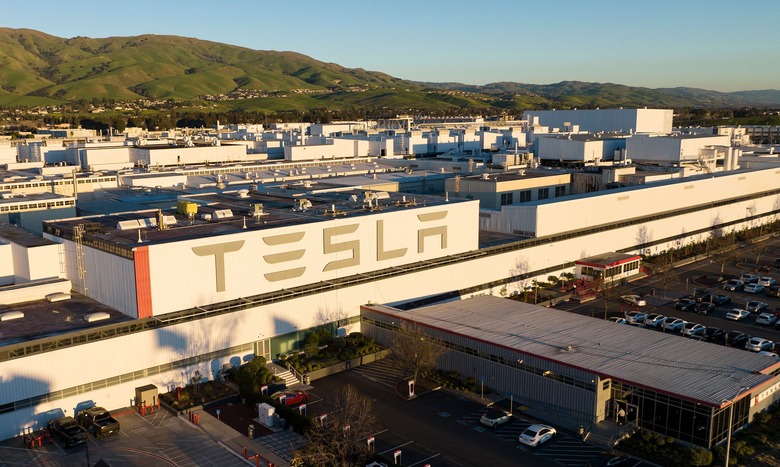 An aerial view shows the Tesla Fremont Factory in Fremont, California on February 10, 2022. - Tesla can hardly make enough electric vehicles to meet booming demand, but behind the world's most valuable auto brand is its troubled California factory that makes most of those cars. The Fremont plant near San Francisco has seen a spate of sexual harassment lawsuits, years of racism allegations -- including a California civil rights agency complaint this week -- and even a murder last year (Photo by JOSH EDELSON / AFP) (Photo by JOSH EDELSON/AFP via Getty Images)