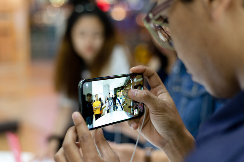 A customer takes a photograph with an iPhone 11 Pro at Apple store during a product launch event in Kuala Lumpur, Malaysia on Friday, September 27, 2019. Apple's new iPhones with camera enhancements and improved battery life go on sale today. (Photo by Chris Jung/NurPhoto via Getty Images)