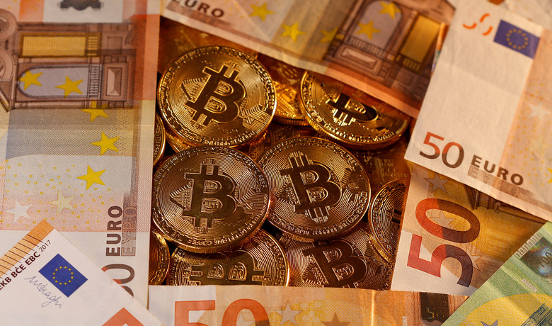 Representations of virtual currency Bitcoin and euro banknotes are seen in this picture illustration taken January 27, 2020. REUTERS/Dado Ruvic/Illustration REFILE - CORRECTING CURRENCY - RC2HOE9S9ODO