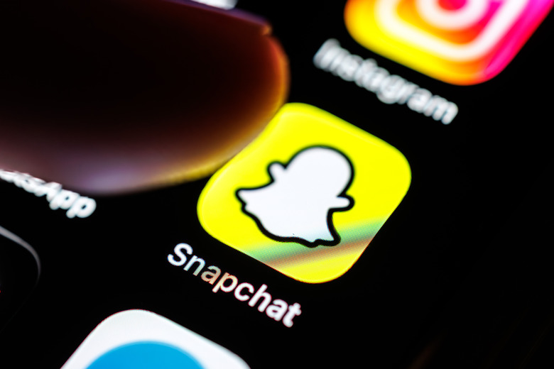07 March 2026, Bavaria, Munich: The Snapchat app logo is seen on the display of a smartphone in Munich (Bavaria, Germany) on March 7, 2026, while a finger taps on the application's icon. Snapchat is a free instant messaging service that enables the private exchange of photos, videos and text messages and the publication of video clips. In 2016, the company Snapchat Inc. was renamed Snap Inc. (pointing finger, icon, symbol image, symbol photo, illustration, symbolic photo, illustrative photo, theme image, general image, theme photo) Photo: Matthias Balk/dpa (Photo by Matthias Balk/picture alliance via Getty Images)