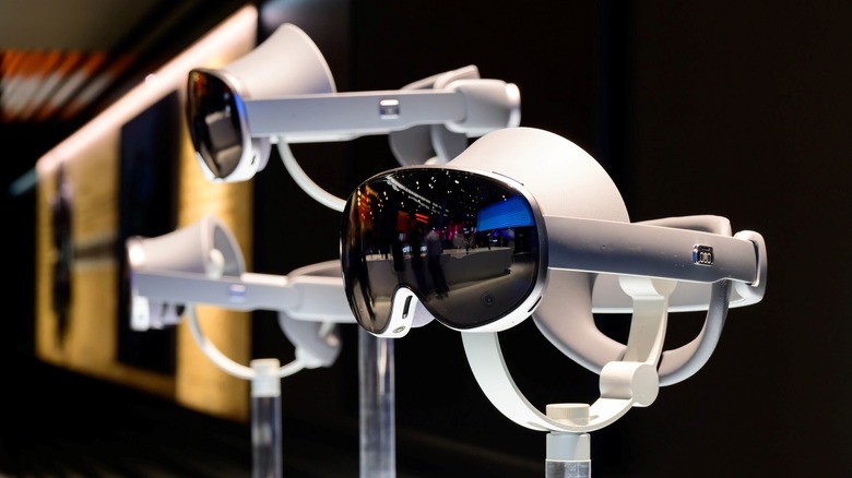Three silver Project Moohan headset on display in Samsung's MWC 2025 booth.