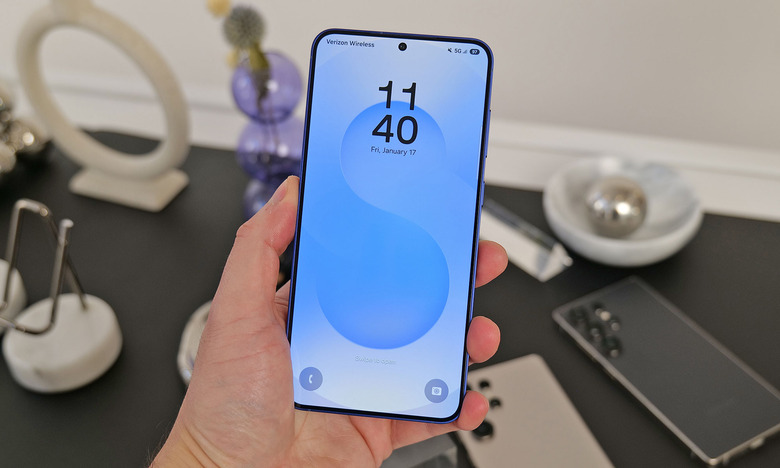Photo of the Samsung Galaxy S25+ in hand at a product demo.