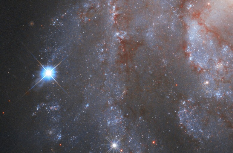 Pictured here is part of the captivating galaxy NGC 2525. Located nearly 70 million light-years from Earth, this galaxy is part of the constellation of Puppis in the southern hemisphere. Together with the Carina and the Vela constellations, it makes up an image of the Argo from ancient greek mythology.Â  On the left, a brilliant supernova is clearly visible in the image. The supernova is formally known as SN2018gv and was first spotted in mid-January 2018. The NASA/ESA Hubble Space Telescope captured the supernova in NGC 2525 as part of one of its major investigations; measuring the expansion rate of the Universe, which can help answer fundamental questions about our Universeâs very nature. Supernovae like this one can be used as cosmic tape measures, allowing astronomers to calculate the distance to their galaxies.Â  ESA/Hubble has now published a unique time-lapse of this galaxy and itâs fading supernova.