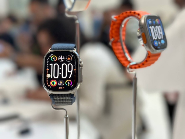 An Apple Watch Ultra 2 on a stand, with another one in the background. 