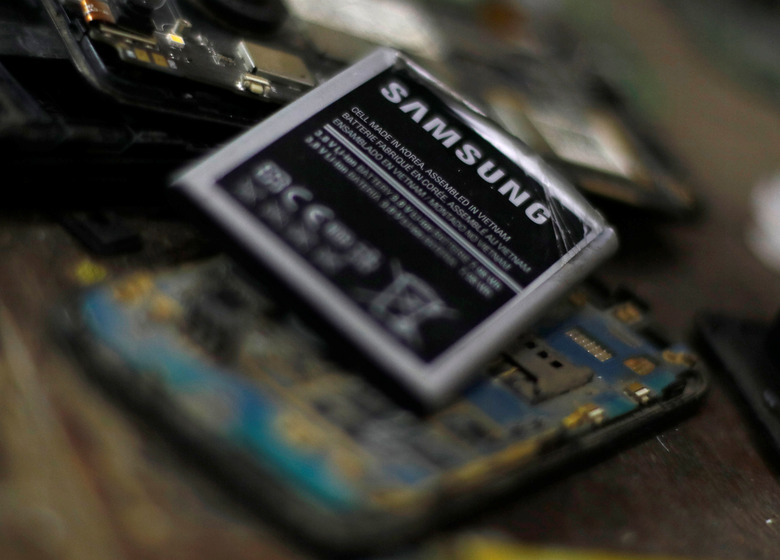 A battery of a Samsung cell phone is seen at a service store belonging to  Raafat Yasar, an engineering technician in Toukh, Al Qalyubia Governorate, north of Cairo, Egypt, November 15, 2018. REUTERS/Amr Abdallah Dalsh