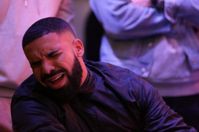 Recording artist Drake reacts in the Jurassic Park fan zone during Game 6 of the NBA Finals between the Toronto Raptors and the Golden State Warriors, televised live from Oakland, in Toronto, Ontario, Canada, June 13, 2019.  REUTERS/Chris Helgren