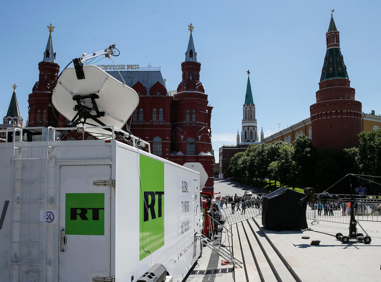 Vehicles of Russian state-controlled broadcaster Russia Today (RT) are seen near the Red Square in central Moscow, Russia June 15, 2018. Picture taken June 15, 2018.  REUTERS/Gleb Garanich