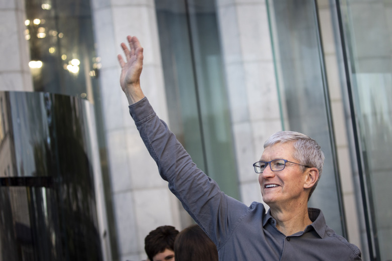 NEW YORK, NY - SEPTEMBER 20: Apple CEO Tim Cook waves to customers before they enter Apple's flagship 5th Avenue store to purchase the new iPhone 11 on September 20, 2019 in New York City.  Apple's new iPhone 11 goes on sale today at the grand re-opening of the 5th Avenue store. (Photo by Drew Angerer/Getty Images)