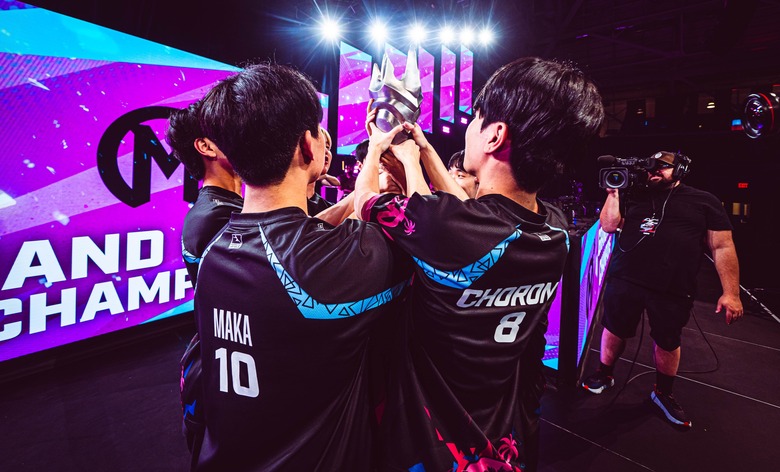 Florida Mayhem players lift the Overwatch League trophy.