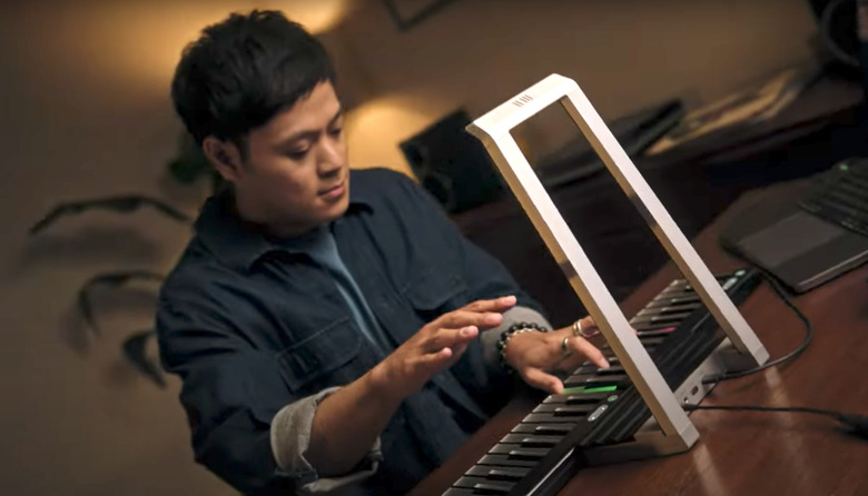A guy using the gadget.
