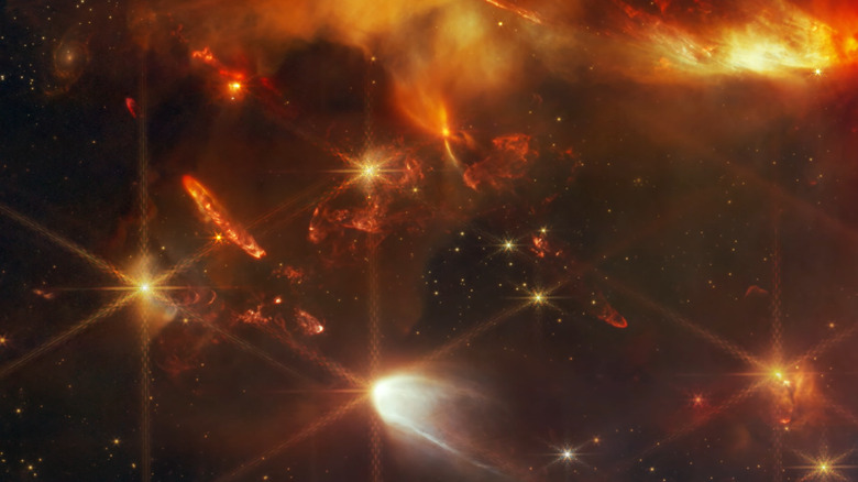 The aligned jets (which look a bit like JJ Abrams-style lens flare) indicate the forming stars spin in the same direction.