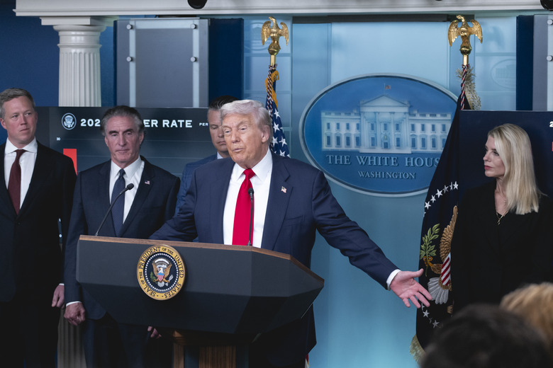 President Donald Trump speaks to reporters, as members of his administration stand on the stage behind him  in the James Brady Press Briefing Room at the White House, from left, Army Secretary Dan Driscoll, Interior Secretary Doug Burgum, Defense Secretary Pete Hegseth, and Attorney General Pam Bondi, Monday, Aug. 11, 2025, in Washington, D.C.. Photo by Cheriss May.
