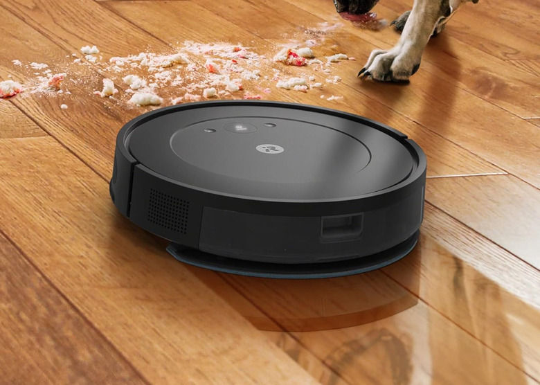 A robovac about to go battle a dog.