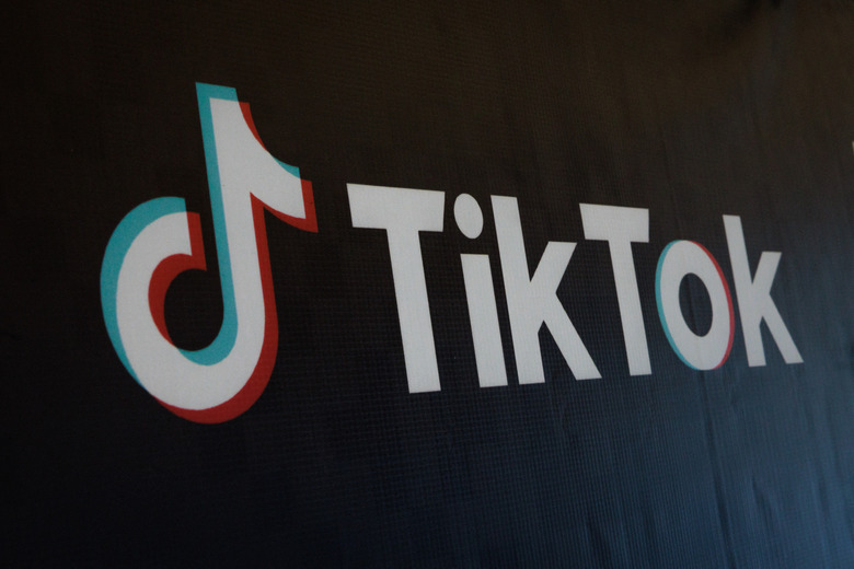 The logo of the social media video sharing app TikTok is seen during the launch of the TikTok and Indonesia's leading e-commerce site Tokopedia's Buy Local Campaign in Jakarta on December 12, 2023. Indonesia in September banned sales on social media to protect small businesses that were losing out to e-commerce giants, forcing TikTok to close its online shopping business in October. It is now set to resume that business in Indonesia -- one of TikTok's largest e-commerce markets -- under a deal with GoTo, which owns the popular local online shopping platform Tokopedia. (Photo by Yasuyoshi CHIBA / AFP) (Photo by YASUYOSHI CHIBA/AFP via Getty Images)