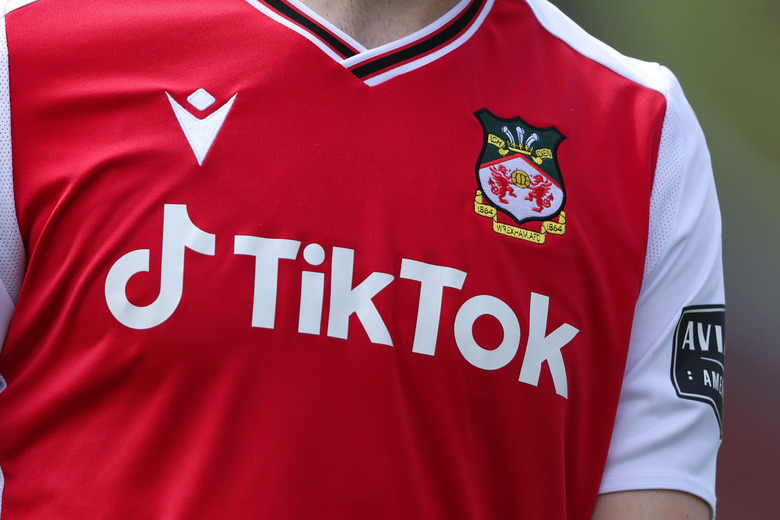 WREXHAM, WALES - MAY 08: 	TikTok, known in China as Douyin, the video-focused social networking service owned by Chinese company ByteDance Ltd with their sponsor logo on the shirt of Wrexham during the Vanarama National League fixture between Wrexham and Stockport County at Racecourse Ground on May 8, 2022 in Wrexham, Wales. (Photo by Matthew Ashton - AMA/Getty Images)