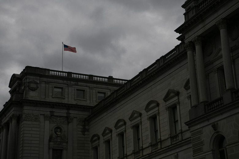 FILE PHOTO: An American flag waves in the wind atop the Library of Congress on Capitol Hill in Washington, U.S., November 22, 2019. REUTERS/Loren Elliott/File Photo