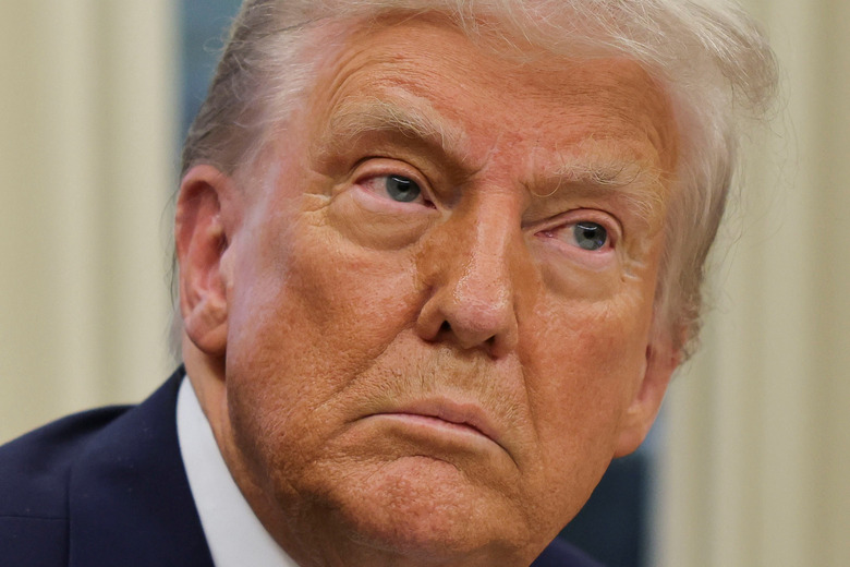 U.S. President Donald Trump looks on, on the day he signs an executive order in the Oval Office at the White House in Washington, U.S., January 31, 2025. REUTERS/Carlos Barria