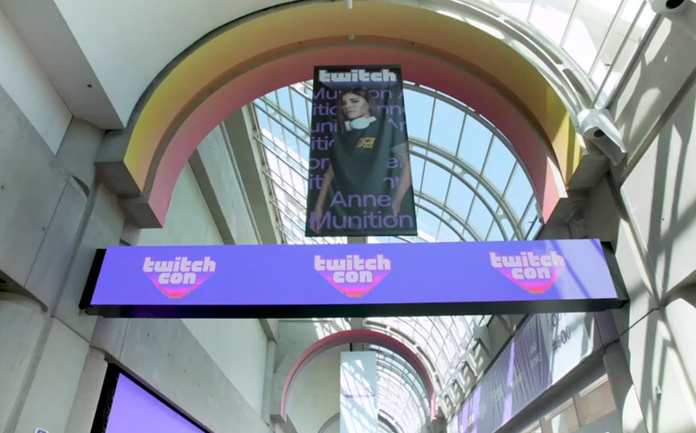 Banners for TwitchCon hang inside a building