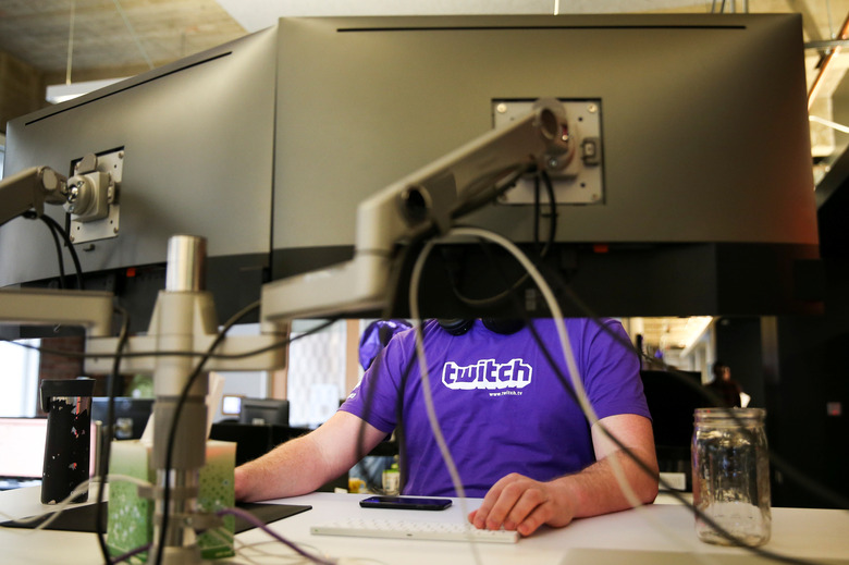 A man works at a computer at the offices of Twitch Interactive Inc, a social video platform and gaming community owned by Amazon, in San Francisco, California, U.S., March 6, 2017.  REUTERS/Elijah Nouvelage