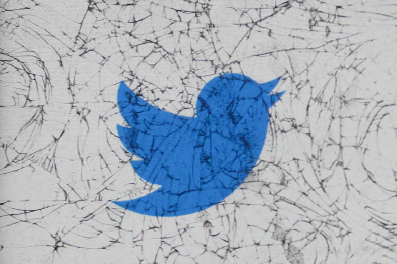 Twitter logo is seen through the broken glass in this illustration photo taken in Krakow, Poland on February 28, 2020. (Photo by Jakub Porzycki/NurPhoto via Getty Images)