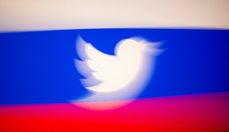 Twitter logo and a Russian flag are displayed in this illustration picture taken March 10, 2021. REUTERS/Dado Ruvic/Illustration