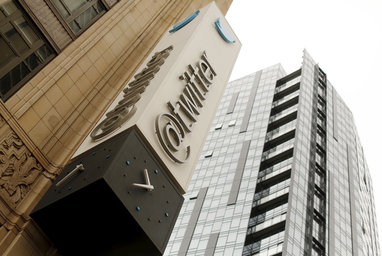 The Twitter logo is shown at its corporate headquarters  in San Francisco, California April 28, 2015. Twitter Inc. cut its full-year revenue forecast due to weak demand for its direct response products, sending its shares down as much as 24 percent on Tuesday. Twitter said it expected 2015 revenue of $2.17 billion to$2.27 billion, compared with an earlier forecast of $2.3 billion to $2.35 billion. Analysts on average had been expecting full-year revenue of $2.37 billion. REUTERS/Robert Galbraith
