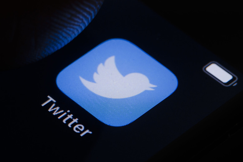 BERLIN, GERMANY - MARCH 10: In this photo illustration the logo of Twitter can be seen on a smartphone on March 10, 2022 in Berlin, Germany. (Photo Illustration by Thomas Trutschel/Photothek via Getty Images)