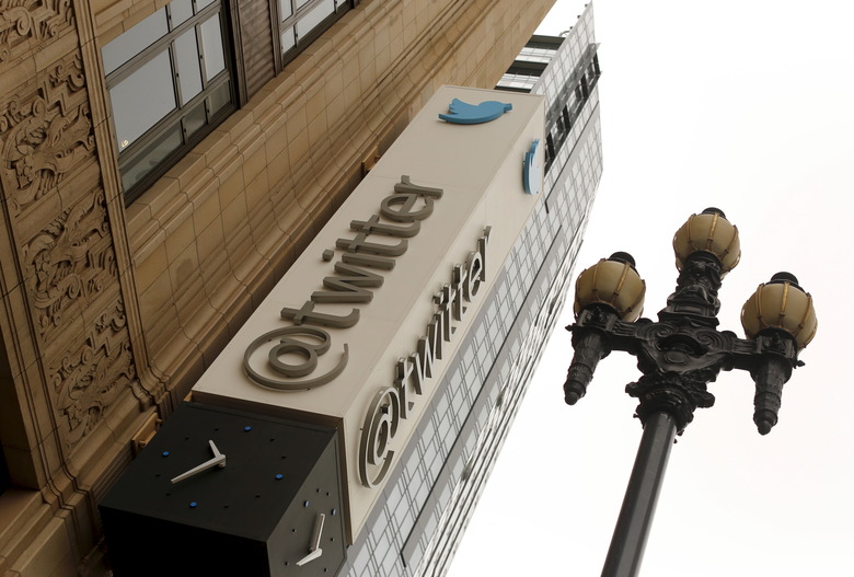 The Twitter logo is shown at its corporate headquarters  in San Francisco, California April 28, 2015. Twitter Inc. cut its full-year revenue forecast due to weak demand for its direct response products, sending its shares down as much as 24 percent on Tuesday.Twitter said it expected 2015 revenue of $2.17 billion to$2.27 billion, compared with an earlier forecast of $2.3 billion to $2.35 billion. Analysts on average had been expecting full-year revenue of $2.37 billion. REUTERS/Robert Galbraith