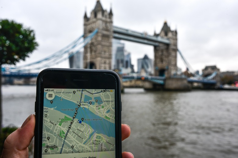 LONDON, ENGLAND - NOVEMBER 25: In this photo illustration the Uber logo is displayed on a phone in front of Tower Bridge on November 25, 2019 in London, England. Transport for London announced today, Monday, that Uber's license won't be renewed after it expires at the end of this month, November. Uber announced that they will appeal the decision. (Photo by Peter Summers/Getty Images)