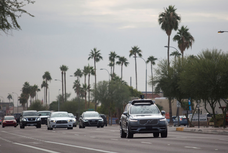 A self driving Volvo vehicle, purchased by Uber, moves along the streets of Scottsdale, Arizona, U.S., December 1, 2017.  Photo taken on December 1, 2017.  REUTERS/Natalie Behring