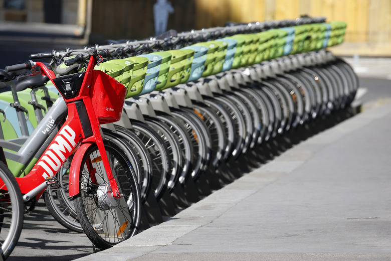 PARIS, FRANCE - MAY 14: An Uber Jump bike and Velib Metropole self-service public bikes are parked at a distribution point during the Coronavirus (COVID-19) pandemic on May 14, 2020 in Paris, France. Paris mayor Anne Hidalgo has launched a policy to promote the circulation of bikes in Paris. France is slowly reopening after almost two months of strict lockdown throughout the country due to the epidemic of coronavirus (COVID 19) on May 14, 2020 in Paris, France. The Coronavirus (COVID-19) pandemic has spread to many countries across the world, claiming over 300,000 lives and infecting over 4.4 million people. (Photo by Chesnot/Getty Images)