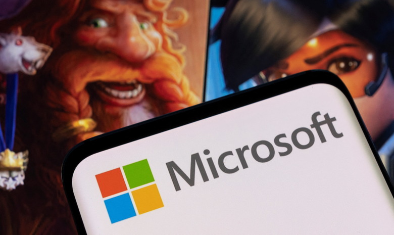 Microsoft logo is seen on a smartphone placed on displayed Activision Blizzard's games characters in this illustration taken January 18, 2022. REUTERS/Dado Ruvic/Illustration