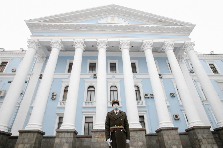 A soldier of the Honour Guard stands in front of the Defence Ministry and General Staff headquarters during a ceremony in tribute to fallen defenders of Ukraine in Kyiv, Ukraine January 28, 2022.  REUTERS/Valentyn Ogirenko