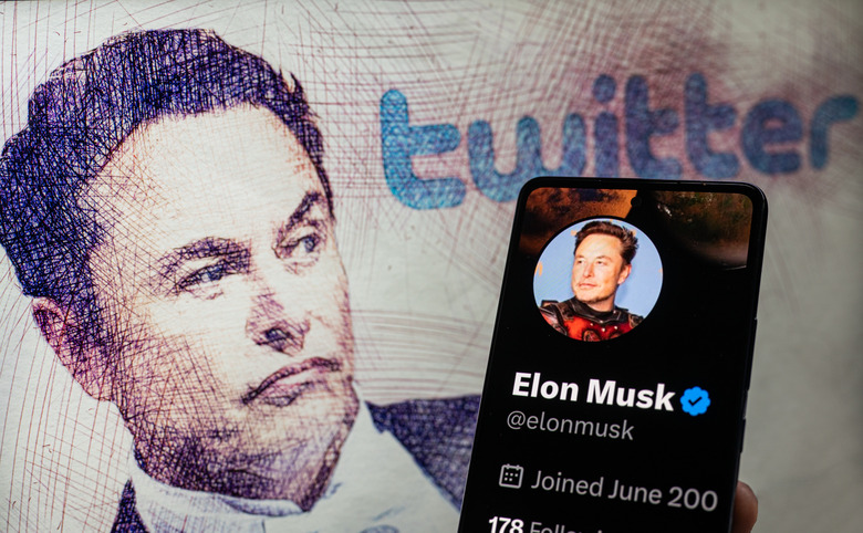 Elon Musk Twitter account  seen on Mobile with Elon Musk in the background on screen, seen in this photo illustration. On 19 February 2023 in Brussels, Belgium. (Photo illustration by Jonathan Raa/NurPhoto via Getty Images)
