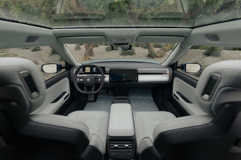 Front seats and dashboard of a Rivian vehicle.