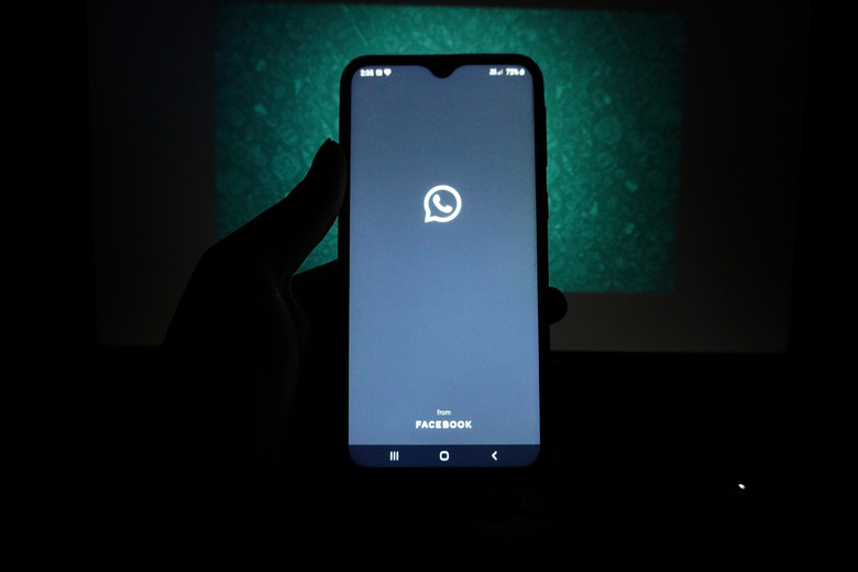 The logo of the messenger app WhatsApp is seen on the screen of a smartphone in New Delhi, India on May 27, 2021. WhatsApp has filed a legal complaint in Delhi against the government seeking to block regulations coming into force from Wednesday that experts say would compel the California-based Facebook unit to break privacy protections, according to Reuters sources. (Photo by Mayank Makhija/NurPhoto via Getty Images)