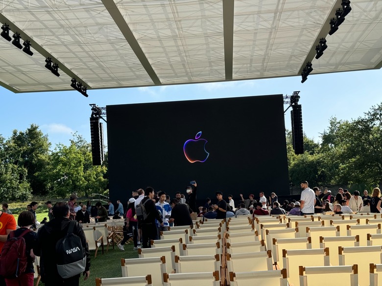 To be clear, we're watching the same pre-taped video stream as you are at home. But we get a giant superbright screen and an overhang that's (mercifully) in the shade.