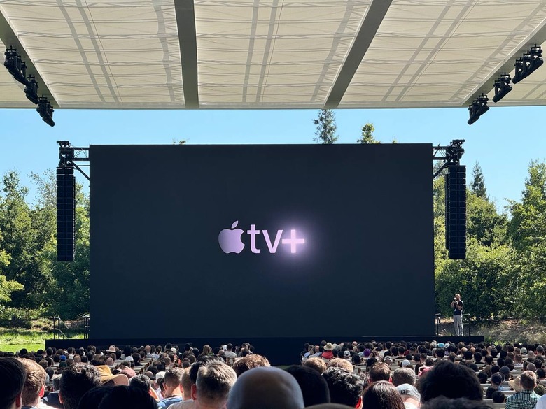 The Apple TV+ on a black background on a screen at the WWDC 2024 stage