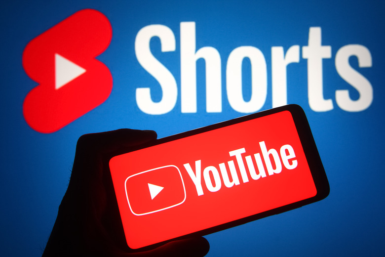 UKRAINE - 2021/10/23: In this photo illustration a YouTube logo of an online video sharing and social media platform is seen on a smartphone screen with a YouTube Shorts in the background. (Photo Illustration by Pavlo Gonchar/SOPA Images/LightRocket via Getty Images)