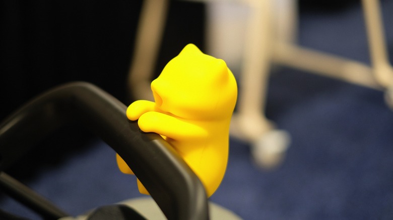 Baby FuFu, positioned on the stroller handle.