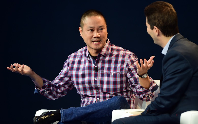 Tony Hsieh, CEO of Zappos, responds to questions from interviewer Dennis Berman at  2015 WSJD Live on October 20, 2015 in Laguna Beach, California. WSJ D Live brings together top CEOs, founders, pioneers, investors and luminaries to explore the most exciting tech opportunities emerging around the world. AFP PHOTO / FREDERIC J. BROWN        (Photo credit should read FREDERIC J. BROWN/AFP via Getty Images)