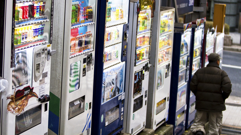 Street scene in Japan with a variety of vending machines.