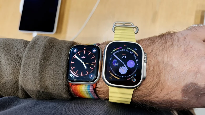 A wrist wearing an Apple Watch Series 8 and Apple Watch Ultra (first-gen)