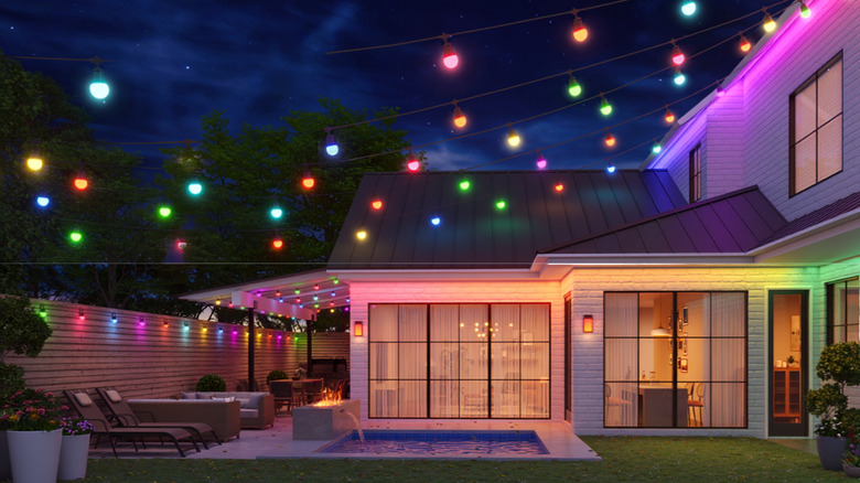 Govee Smart String Lights 2 strung across backyard; nighttime scene, fully lit.